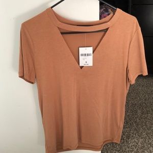 short sleeved beige shirt